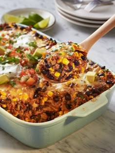 a casserole dish filled with mexican food