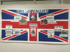 a british flag is hanging on the wall in front of a sign that says british values