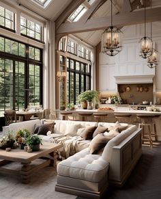 a living room filled with furniture and lots of windows