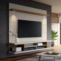 a living room with a large flat screen tv mounted to the side of a wall