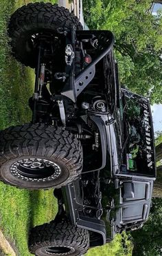 an off - road vehicle is parked in the grass