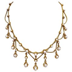 This elegant Belle Époque necklace is composed of collet set oriental pearls and rose cut diamonds connected by foxtail gold chains. The clasp is hallmarked with French assay marks, the eagle's heads. The top row is set with 17 pearls, the eleven dangling elements are set with a further 18 pearls. In all the necklace is decorated with 22 Diamonds. Targaryen Jewelry, 1800s Jewelry, Antique Jewelry Victorian, Bijoux Art Nouveau, Antique Jewellery Designs, Miss Marple, Nouveau Jewelry, Jewellery Vintage, Art Nouveau Jewelry