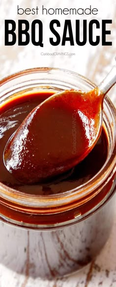 the best homemade bbq sauce in a glass jar with a wooden spoon on top