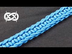 a close up of a blue rope on a black surface