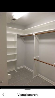 an empty walk in closet with shelves and toilet