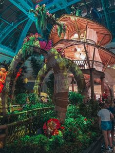 people are standing in front of an elaborate display at the convention or indoor show hall