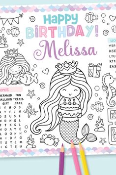 a birthday coloring book with mermaids and princesses on it, surrounded by colored pencils