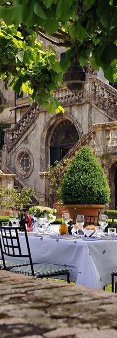 an outdoor dining area with tables and chairs