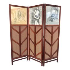 a room divider with three panels and pictures on the wall behind it, in front of a white background