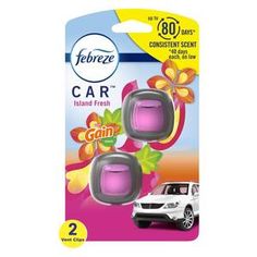 two pink car air fresheners in front of a white car