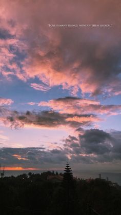 the sky is pink and blue with clouds