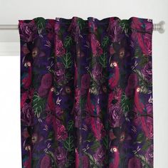 a purple curtain hanging on the side of a window with birds and flowers printed on it