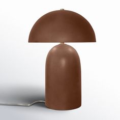 a brown lamp sitting on top of a table