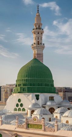 a large green and white dome on top of a building