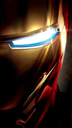 the iron man mask is glowing in the dark with light coming from it's eyes