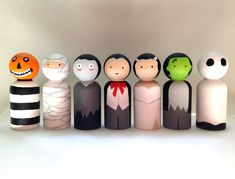 a group of wooden dolls sitting next to each other