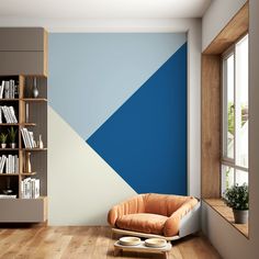 a room with a chair, bookshelf and bookcases on the wall