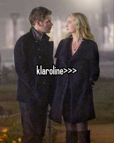 a man and woman standing next to each other in front of a building with the words klarolinne > > >