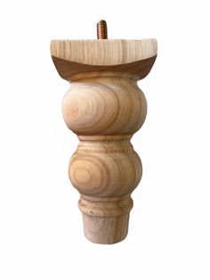 a wooden pedestal with a screw in it