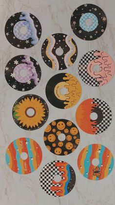 eight donuts with different designs on them are arranged in a circular pattern, and one is