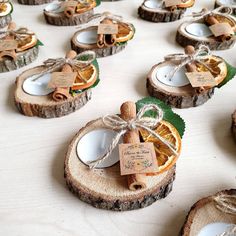 small slices of oranges are tied with twine and placed on wood slices for decoration