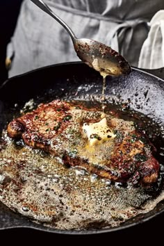 someone is cooking some food in a skillet