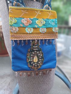 a woman's purse with many different colors and designs on it