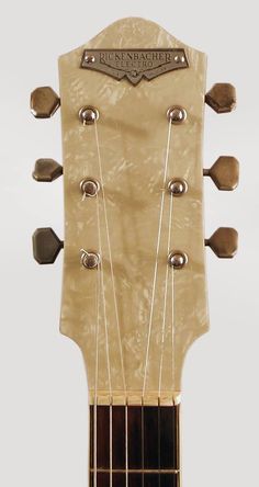 an acoustic guitar headstocked with strings