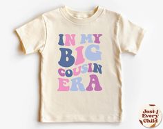 In my Big Cousin Era, Trendy Kid Shirt, ,Funny Toddler Shirt, Pregnancy Reveal T-Shirt, Siblings Shirt,  Cousin Natural Body, Cousin Sweater ✧ All of the t-shirts and bodysuits at our shop are made of 100% certified pure organic cotton. Elegant t-shirt with round neckline and short sleeves. The loose fit and softness of the cotton gives you freedom of movement. ✧Our sweatshirts are very soft, cute and lightweight, bound to keep you warm. Kid's unisex cotton blouse made of cotton with elastic at Playful Letter Print T-shirt For Gender Reveal, Fun Tops With Funny Print For Gender Reveal, Funny Toddler Shirt, Funny Toddler, Toddler Humor, Sibling Shirts, Pregnancy Reveal, Trendy Kids, Cotton Blouse