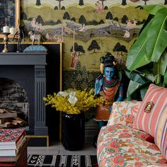 a living room filled with furniture and a fire place next to a painting on the wall