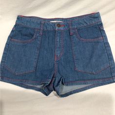 These Shorts Are Almost Vintage, About 15 Years Old. Were Washed But Never Worn. Very 70’s Hippie Style. Blue With Red Stitching. Size 28 Waist. Approximate Measurements Waist- 14.25” Rise-10” Inseam-2” Leg Opening- 11.5” Red Retro Denim Bottoms, Casual Red Denim Bottoms, Retro Blue Jean Shorts With Pockets, High Waist Red Denim Jean Shorts, Red High Waist Denim Jean Shorts, Red High-waisted Denim Jean Shorts, Casual High Rise Red Jean Shorts, Retro Short Length Blue Jeans, Red Denim Shorts For Spring