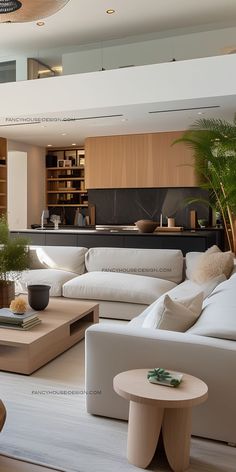 a living room filled with white furniture and lots of plants on top of it's tables