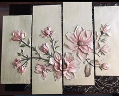 three paintings with flowers painted on them in different stages of being made by someone using acrylic paint