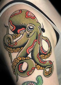 an octopus tattoo on the arm