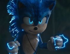 sonic the hedgehog is glowing blue and holding his arm up in front of him