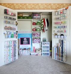 an organized craft room with lots of storage and supplies on the shelves, along with other crafting supplies