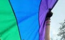 a woman holding a colorful kite in her hands