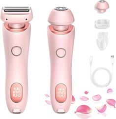 two pink electric shavers sitting next to each other on a white background with rose petals