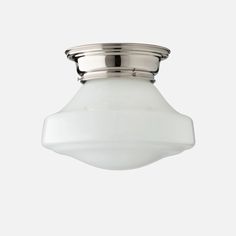 a ceiling light with a white glass shade