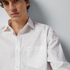 "Find GUCCI Cotton Boxy Shirt With Double G Ready-to-wear on Editorialist. A concept continuously explored by the Creative Director, tailor-inspired pieces combine sartorial excellence and an eclectic vision. This cotton shirt has a tonal Double G embroidery that gives a subtle nod to the House. White cotton, Double G embroidery, Long sleeves, Point collar, Button-through cuffs, Mother of pearl buttons, Boxy fit, Made in Italy, The model is 6\" tall. The product shown in this image is a size 15+ Gucci Cotton Shirt For Work, Casual Gucci Tops For Work, Gucci Cotton Shirt For Spring, Gucci Collared Tops For Work, Gucci Collared Shirt For Work, Gucci Spread Collar Shirt For Work, Gucci Spread Collar Tops For Work, Gucci Fitted Shirt For Spring, Gucci Tops With Spread Collar For Work