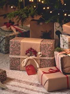 presents under the christmas tree are wrapped in brown paper