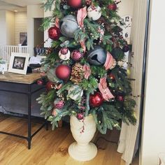 a decorated christmas tree in a living room