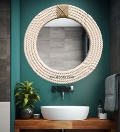 a round rope mirror hangs above a bathroom sink