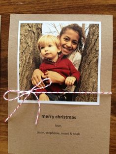 a christmas card with a photo of two children on it and the words merry christmas