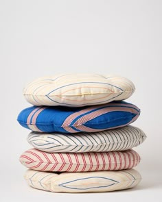 four pillows stacked on top of each other