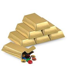 a pile of gold bars next to some candy