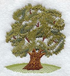 a small embroidered tree on a white towel