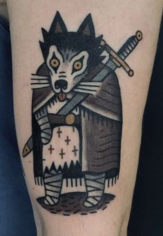 a black and white tattoo with a wolf holding two swords in it's paws