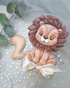 a cake topper with a lion on it