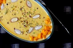 a bowl filled with food sitting on top of a table